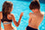 Boy and girl at pool with mineral sunscreen on shoulder